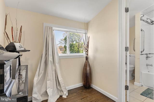rec room featuring baseboards and wood finished floors