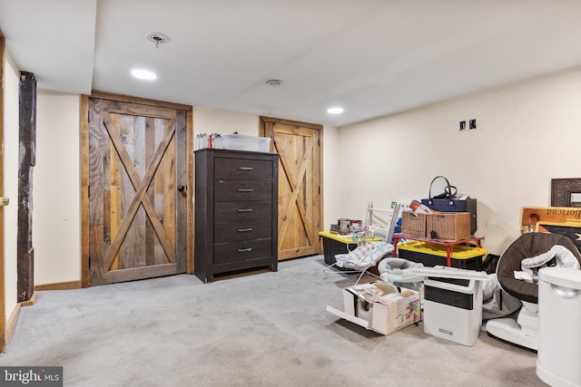 finished below grade area with recessed lighting and carpet