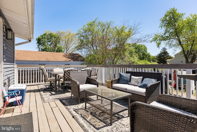 deck with an outdoor hangout area and outdoor dining space