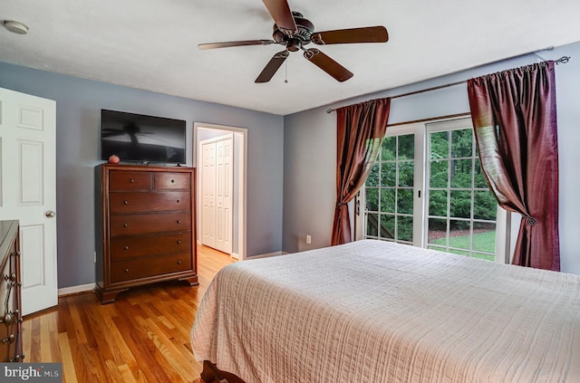 4985 Tall Oaks Dr, Monrovia, MD 21770 - bedroom featuring a ceiling fan, wood finished floors, and baseboards