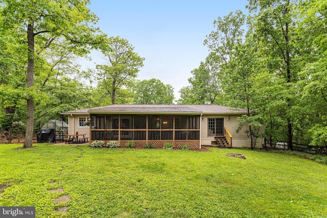 4985 Tall Oaks Dr, Monrovia, MD 21770 - back of property with a yard, entry steps, a sunroom, and fence