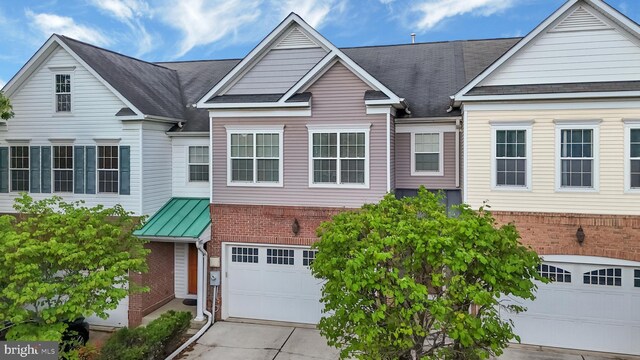 8507 Young Rivers Ct Unit 22, Laurel, MD 20723 - traditional home with brick siding, an attached garage, concrete driveway, and roof with shingles