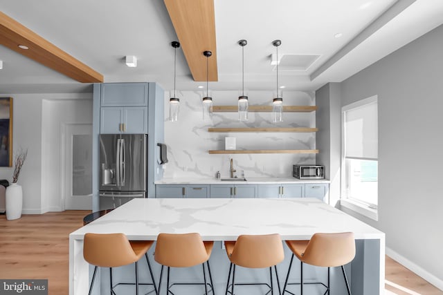 8507 Young Rivers Ct Unit 22, Laurel, MD 20723 - kitchen featuring stainless steel fridge with ice dispenser, open shelves, light wood-style flooring, and backsplash