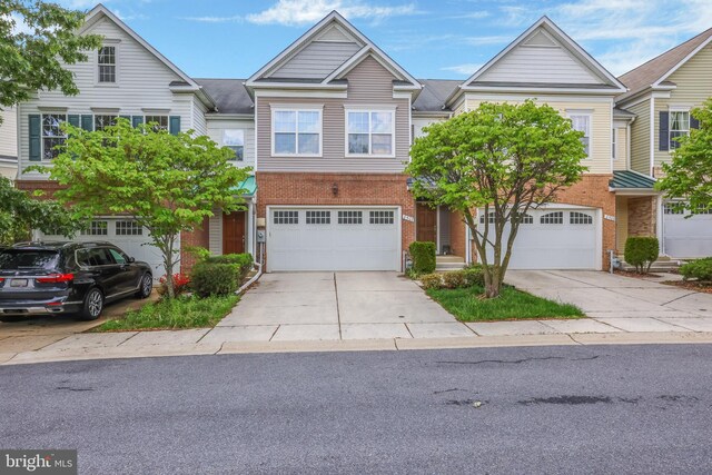 8507 Young Rivers Ct Unit 22, Laurel, MD 20723 - townhome / multi-family property with brick siding, concrete driveway, and a garage