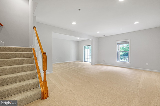 8507 Young Rivers Ct Unit 22, Laurel, MD 20723 - unfurnished living room with light colored carpet, stairs, recessed lighting, and baseboards