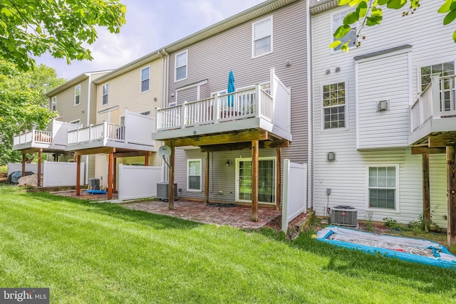 8507 Young Rivers Ct Unit 22, Laurel, MD 20723 - rear view of house with a yard, central AC unit, and a wooden deck