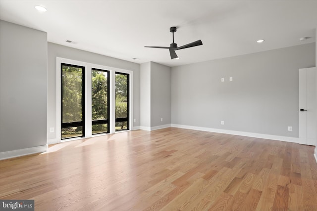 spare room with baseboards, visible vents, recessed lighting, light wood-style floors, and ceiling fan