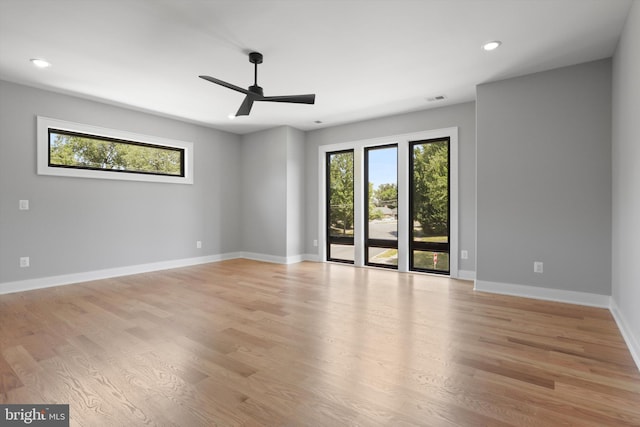 unfurnished room with light wood-style flooring, baseboards, visible vents, recessed lighting, and a ceiling fan