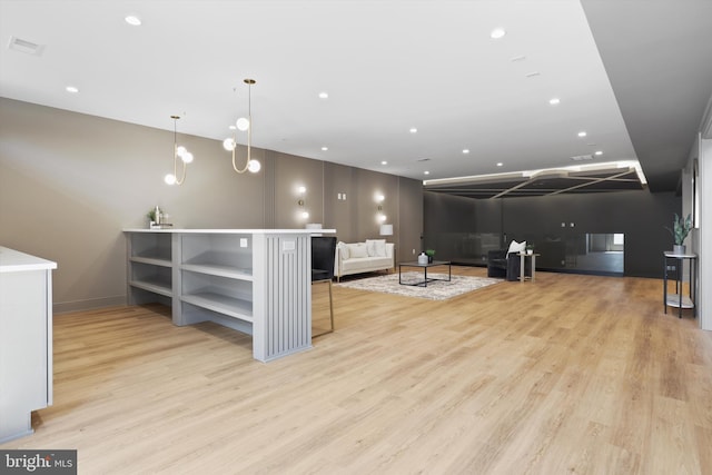 interior space with recessed lighting, light wood-style flooring, and visible vents