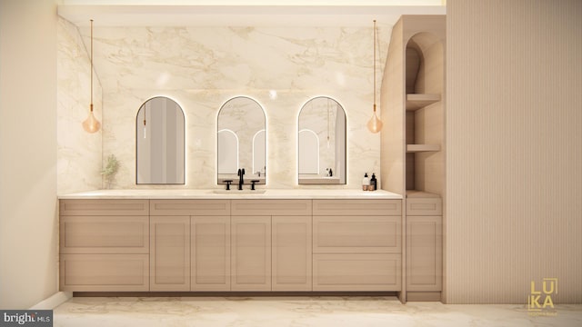 bathroom with marble finish floor and vanity