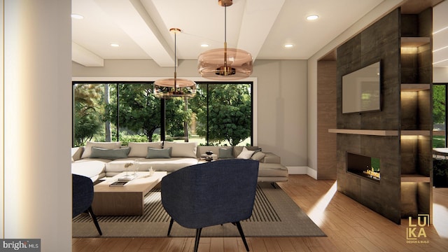 living area with baseboards, a tiled fireplace, hardwood / wood-style flooring, and beamed ceiling