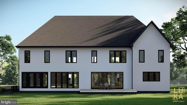 back of house featuring a yard