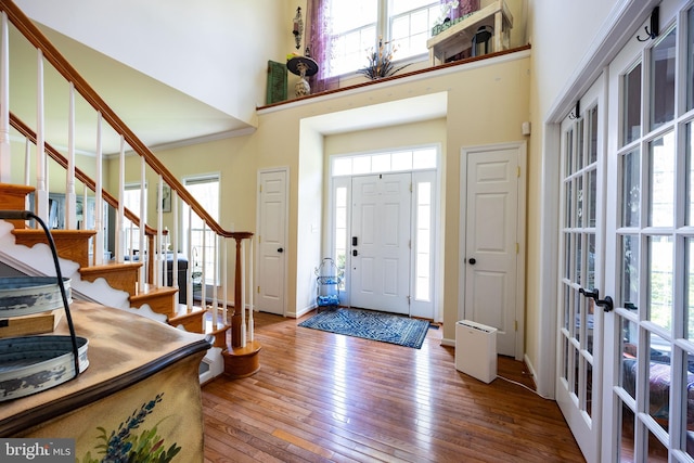 350 Rotterham Dr, Hedgesville, WV 25427 - foyer entrance with hardwood / wood-style flooring, a healthy amount of sunlight, and a high ceiling