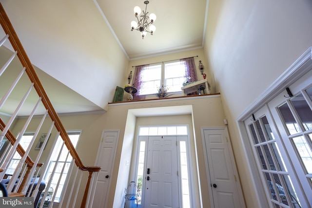 350 Rotterham Dr, Hedgesville, WV 25427 - foyer entrance featuring an inviting chandelier, stairway, ornamental molding, and a high ceiling