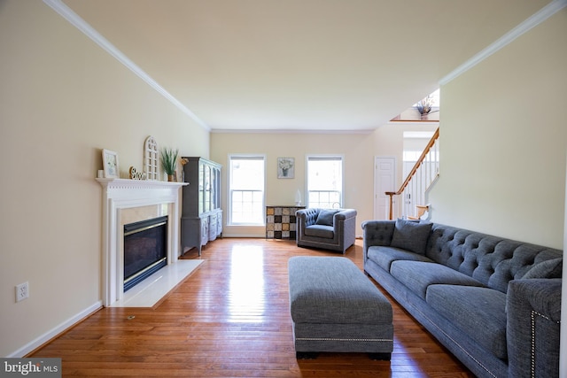 350 Rotterham Dr, Hedgesville, WV 25427 - living area featuring a high end fireplace, baseboards, ornamental molding, wood finished floors, and stairs
