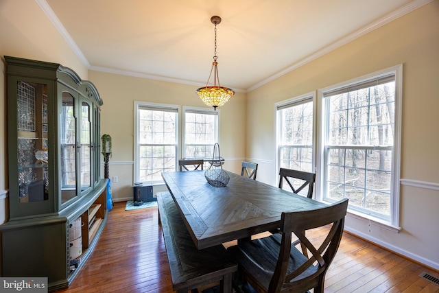 350 Rotterham Dr, Hedgesville, WV 25427 - dining space featuring baseboards, visible vents, ornamental molding, and wood-type flooring