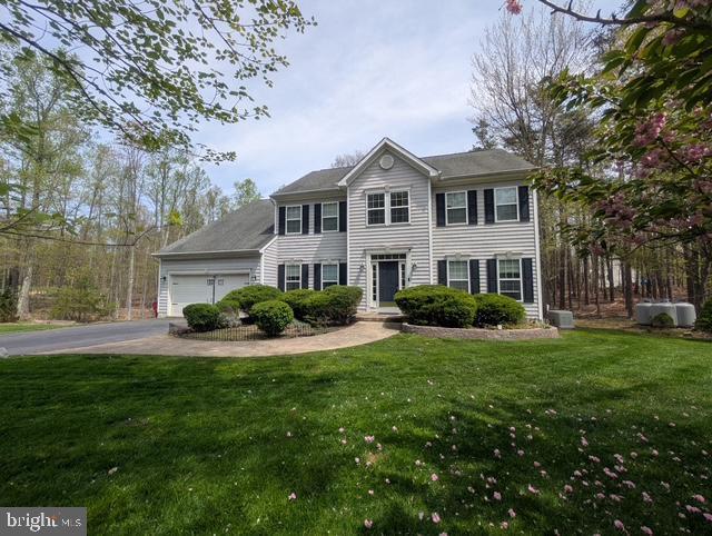 350 Rotterham Dr, Hedgesville, WV 25427 - colonial-style house featuring driveway, a front yard, and a garage