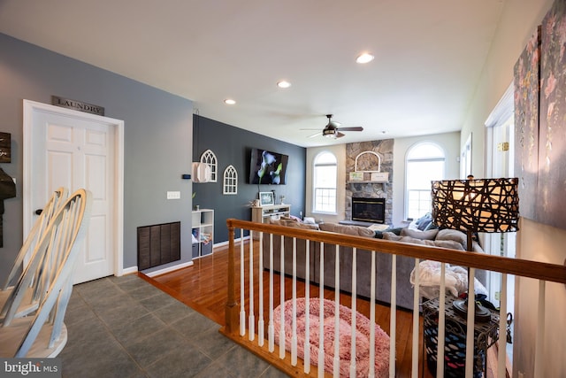 350 Rotterham Dr, Hedgesville, WV 25427 - living room with recessed lighting, a ceiling fan, a stone fireplace, and baseboards