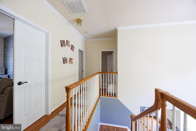 350 Rotterham Dr, Hedgesville, WV 25427 - hallway featuring crown molding, an upstairs landing, visible vents, and wood finished floors