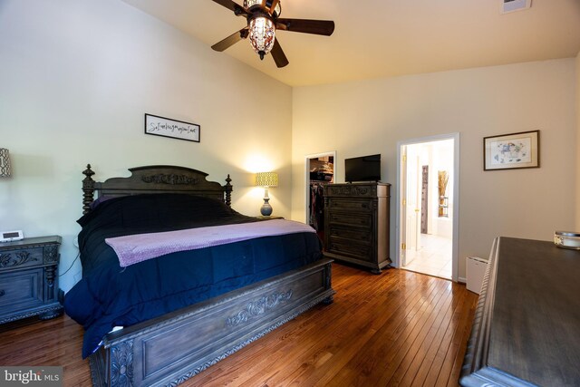 350 Rotterham Dr, Hedgesville, WV 25427 - bedroom featuring lofted ceiling, visible vents, wood-type flooring, a spacious closet, and a ceiling fan