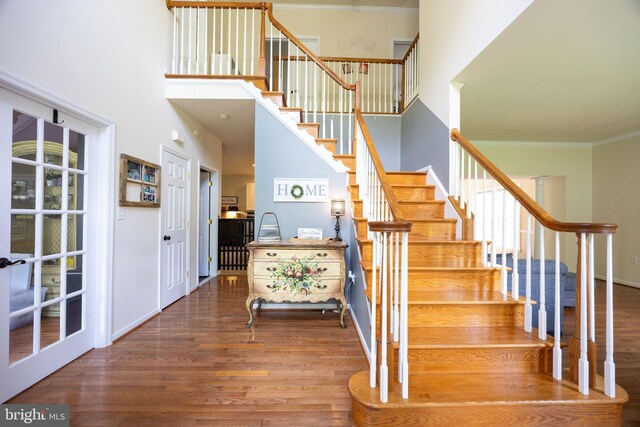 350 Rotterham Dr, Hedgesville, WV 25427 - staircase with a towering ceiling, wood finished floors, crown molding, and baseboards