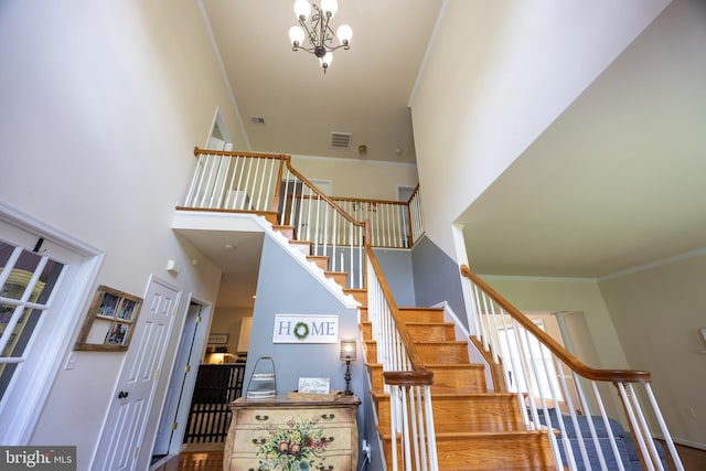 350 Rotterham Dr, Hedgesville, WV 25427 - staircase with visible vents, a notable chandelier, crown molding, and a towering ceiling