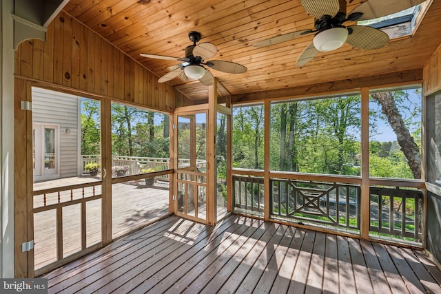 unfurnished sunroom featuring ceiling fan
