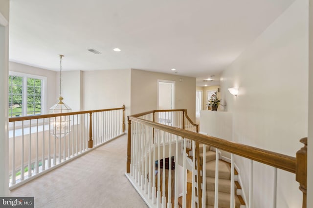 hall featuring recessed lighting, visible vents, and carpet floors