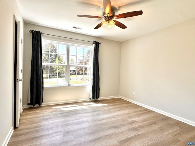 276 Rustling Oaks Way, Ruckersville, VA 22968 - unfurnished room featuring light wood-type flooring, baseboards, a ceiling fan, and visible vents