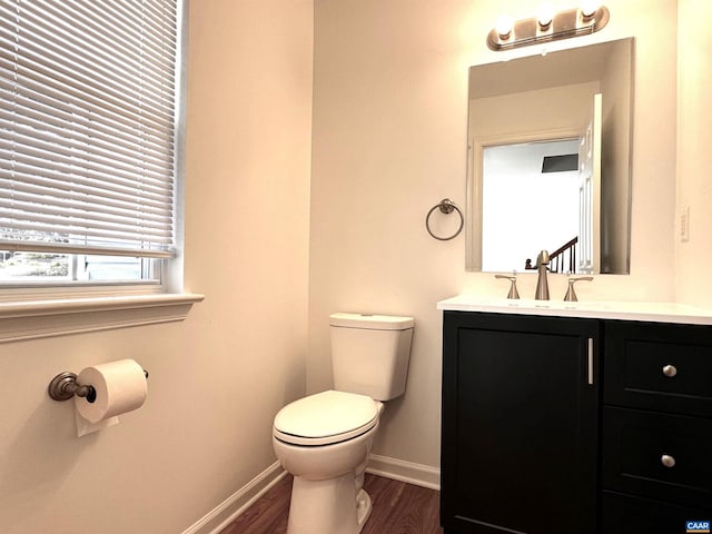 276 Rustling Oaks Way, Ruckersville, VA 22968 - half bathroom with toilet, vanity, wood finished floors, and baseboards