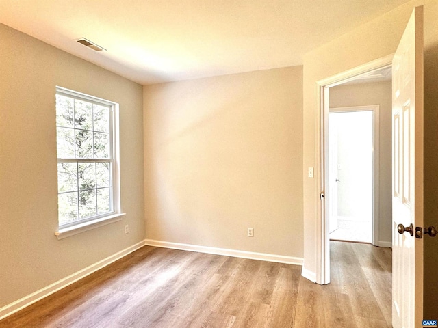 276 Rustling Oaks Way, Ruckersville, VA 22968 - empty room featuring light wood-type flooring, baseboards, visible vents, and a wealth of natural light
