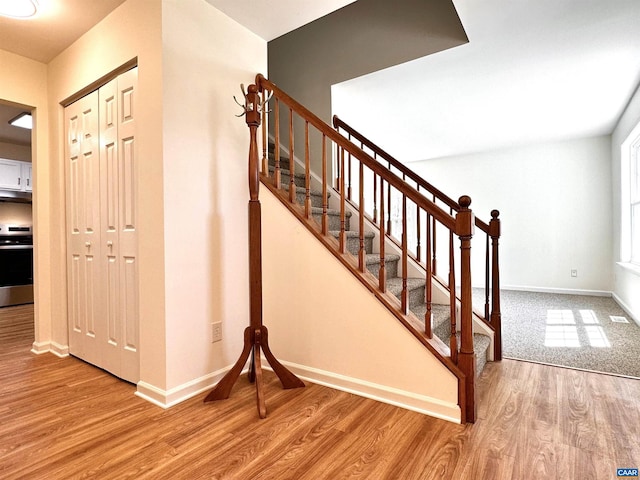 276 Rustling Oaks Way, Ruckersville, VA 22968 - stairs featuring wood finished floors, visible vents, and baseboards