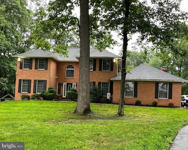 4 Brian Daniel Ct, Reisterstown, MD 21136 - colonial house featuring brick siding, a front lawn, and a chimney