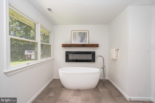 4 Brian Daniel Ct, Reisterstown, MD 21136 - bathroom featuring a freestanding tub and tile patterned floors