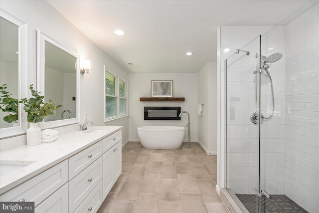 4 Brian Daniel Ct, Reisterstown, MD 21136 - bathroom featuring a stall shower, a freestanding bath, double vanity, and recessed lighting