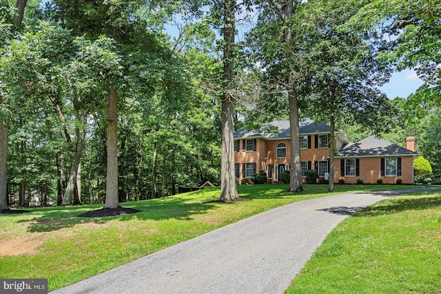 4 Brian Daniel Ct, Reisterstown, MD 21136 - colonial home with a front lawn, driveway, a chimney, and brick siding
