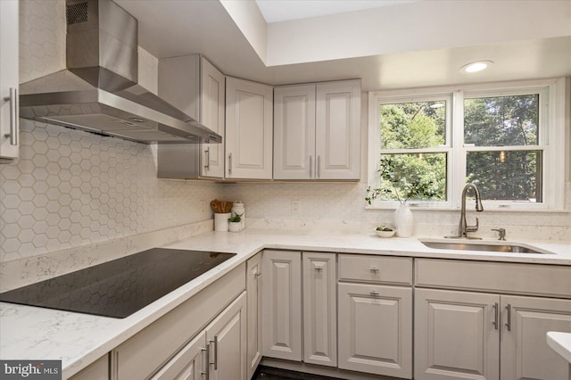 4 Brian Daniel Ct, Reisterstown, MD 21136 - kitchen with wall chimney exhaust hood, black electric cooktop, tasteful backsplash, and light stone counters
