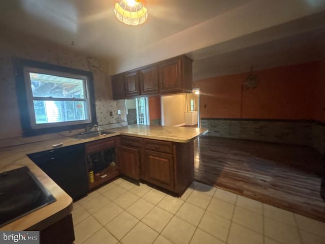 22 Trebing Ct, Willingboro, NJ 08046 - kitchen with light countertops, a sink, light tile patterned flooring, a peninsula, and open floor plan