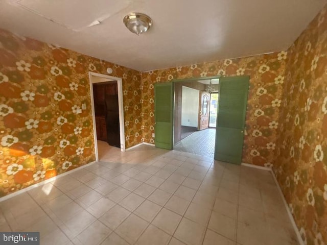 22 Trebing Ct, Willingboro, NJ 08046 - empty room featuring wallpapered walls, tile patterned floors, and baseboards