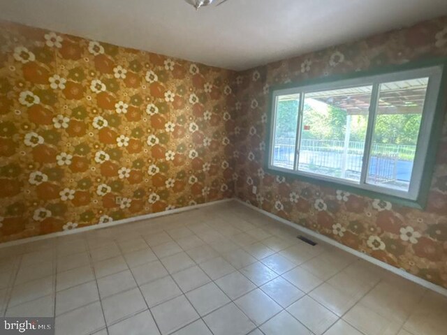 22 Trebing Ct, Willingboro, NJ 08046 - tiled empty room with wallpapered walls and baseboards