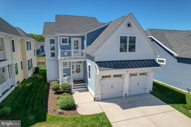 11520 Maull Rd Unit S-183, Lewes, DE 19958 - view of front facade with a garage, a standing seam roof, a shingled roof, board and batten siding, and concrete driveway