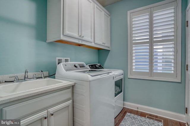 11520 Maull Rd Unit S-183, Lewes, DE 19958 - laundry room featuring baseboards, dark wood-style floors, separate washer and dryer, a sink, and cabinet space