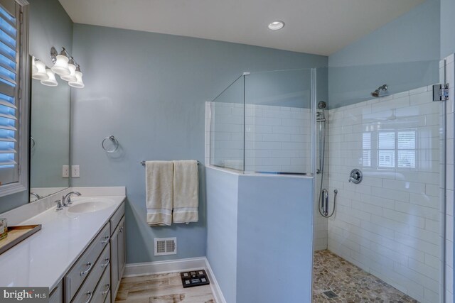 11520 Maull Rd Unit S-183, Lewes, DE 19958 - bathroom with visible vents, vanity, baseboards, a stall shower, and vaulted ceiling