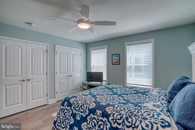 11520 Maull Rd Unit S-183, Lewes, DE 19958 - bedroom with multiple closets, a ceiling fan, and wood finished floors