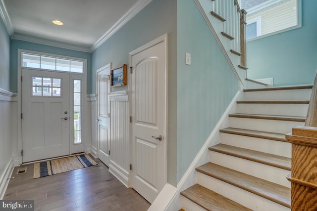 11520 Maull Rd Unit S-183, Lewes, DE 19958 - foyer entrance featuring crown molding, a decorative wall, a wainscoted wall, stairs, and wood finished floors