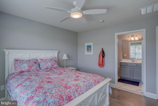 11520 Maull Rd Unit S-183, Lewes, DE 19958 - bedroom featuring ceiling fan, baseboards, wood finished floors, ensuite bathroom, and visible vents