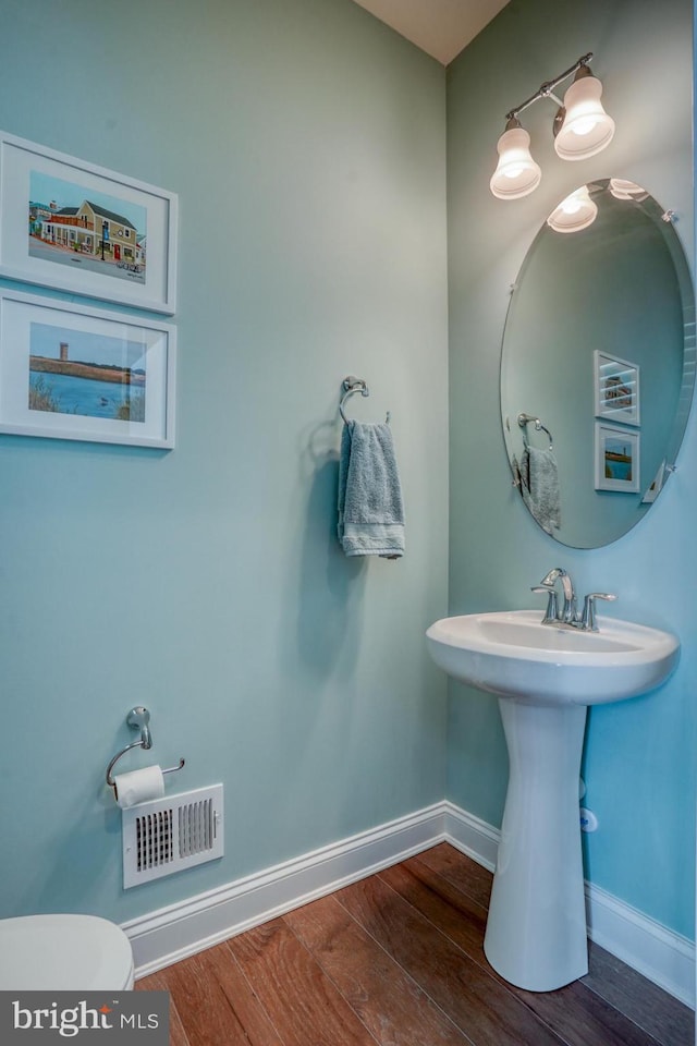 11520 Maull Rd Unit S-183, Lewes, DE 19958 - bathroom featuring visible vents, baseboards, wood finished floors, and toilet