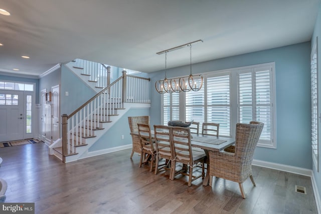 11520 Maull Rd Unit S-183, Lewes, DE 19958 - dining area featuring baseboards, an inviting chandelier, wood finished floors, and stairway