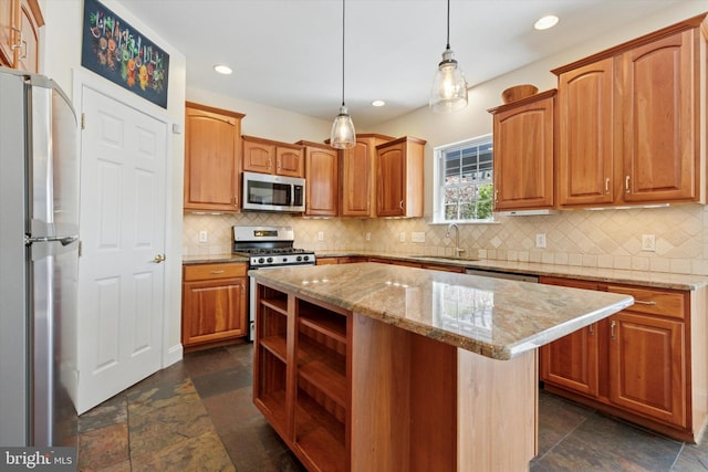 kitchen with a center island, stainless steel appliances, backsplash, and a sink