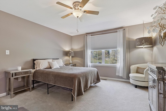 bedroom with ceiling fan, carpet floors, and baseboards